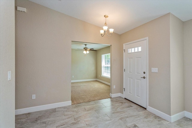 entryway with light colored carpet and ceiling fan with notable chandelier