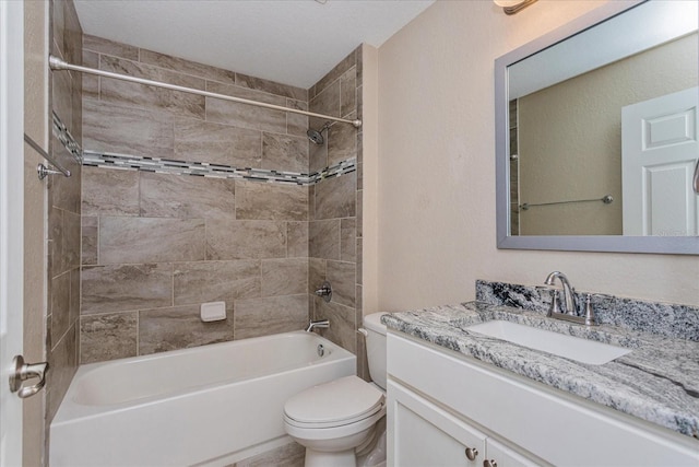 full bathroom featuring vanity, toilet, and tiled shower / bath