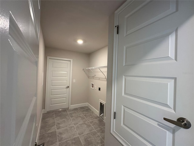 spacious closet with tile patterned floors