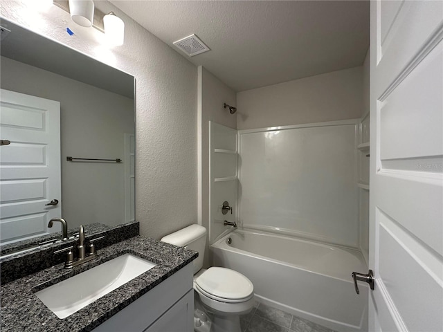 full bathroom featuring vanity, toilet, shower / bath combination, a textured ceiling, and tile patterned flooring