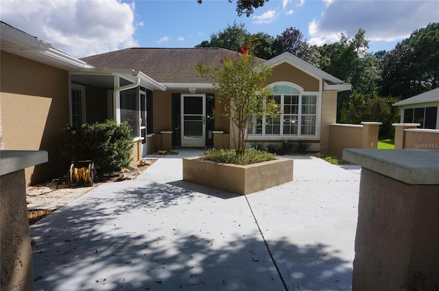 single story home featuring a patio