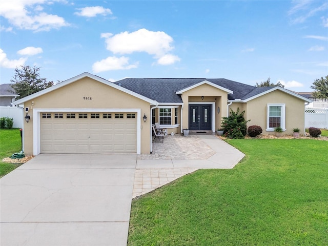 ranch-style home with a garage and a front yard