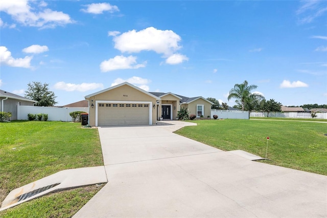 ranch-style home featuring a garage and a front lawn