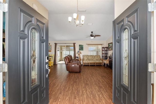 foyer entrance featuring hardwood / wood-style flooring and ceiling fan with notable chandelier