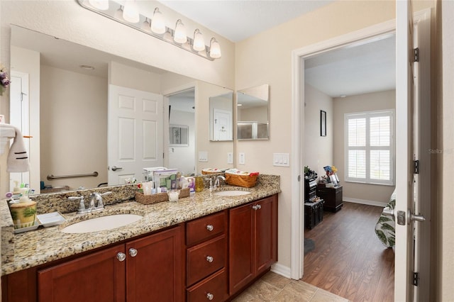 bathroom featuring vanity and wood-type flooring