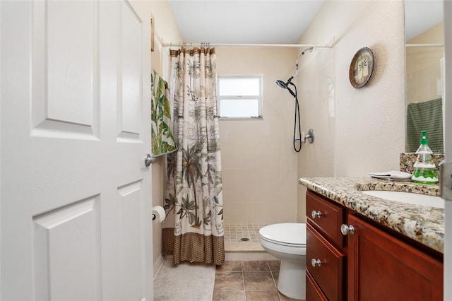 bathroom with vanity, toilet, and walk in shower