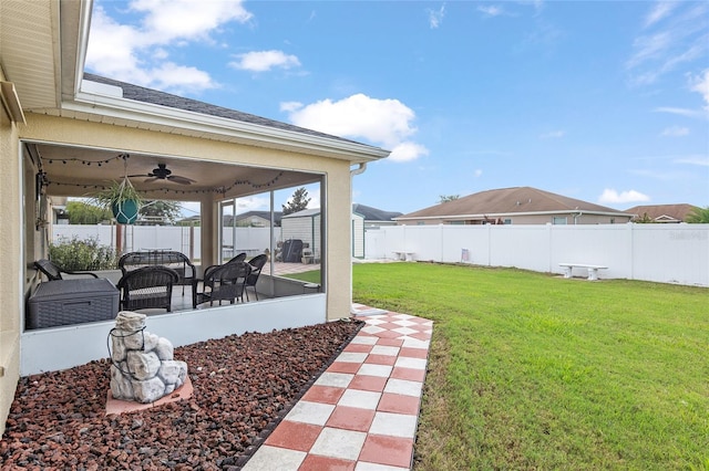 view of yard with a sunroom, an outdoor hangout area, and ceiling fan