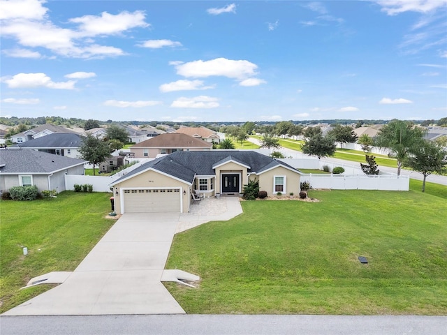 single story home with a garage and a front lawn