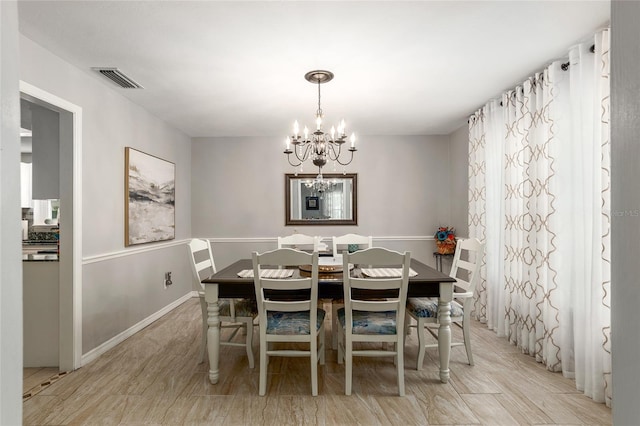 dining room featuring a chandelier