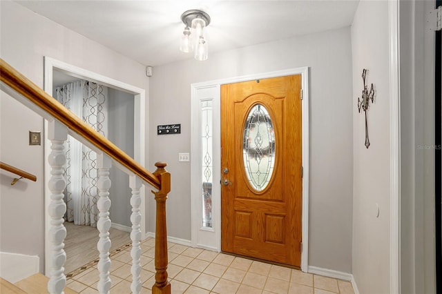 foyer entrance with light tile patterned floors