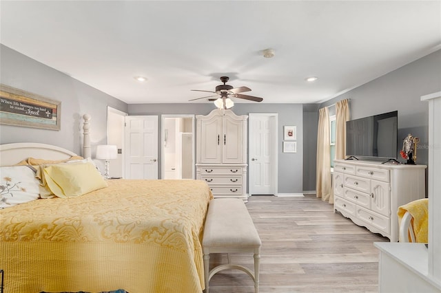 bedroom featuring light hardwood / wood-style floors and ceiling fan