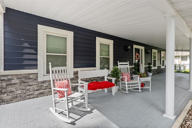 view of patio featuring a porch