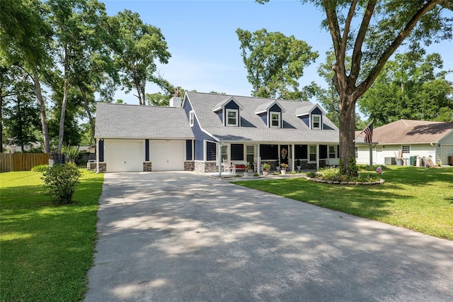 new england style home featuring a garage and a front lawn