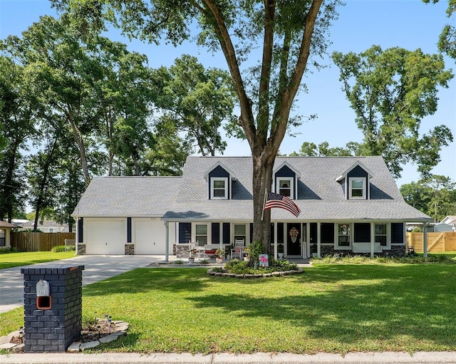 cape cod home featuring a front lawn and covered porch