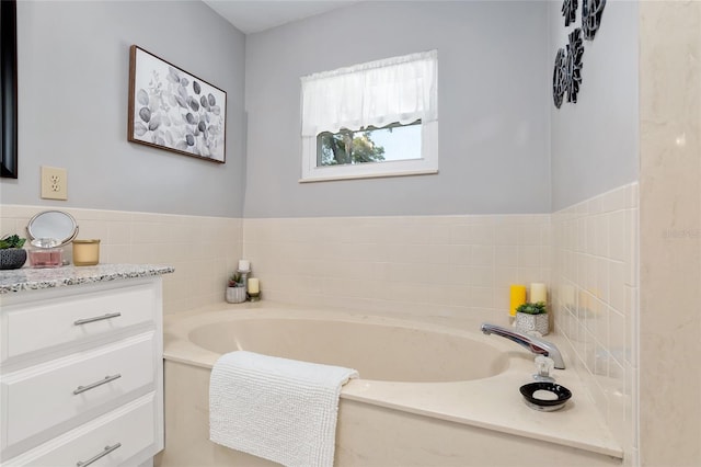 bathroom featuring vanity and a bathtub