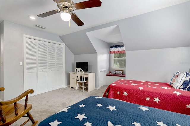 bedroom featuring light carpet, a closet, lofted ceiling, and ceiling fan