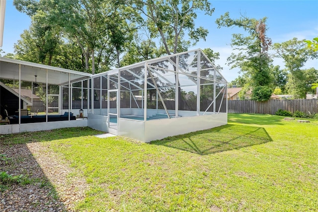 view of yard featuring a lanai and a fenced in pool