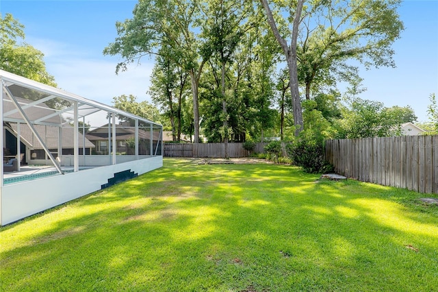 view of yard with a lanai