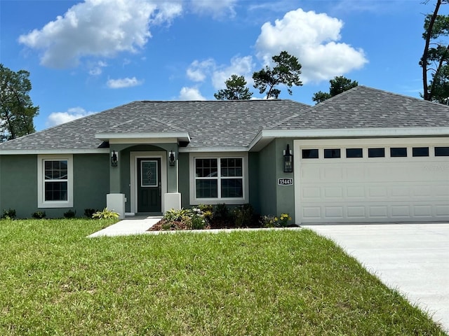 single story home with a front yard and a garage