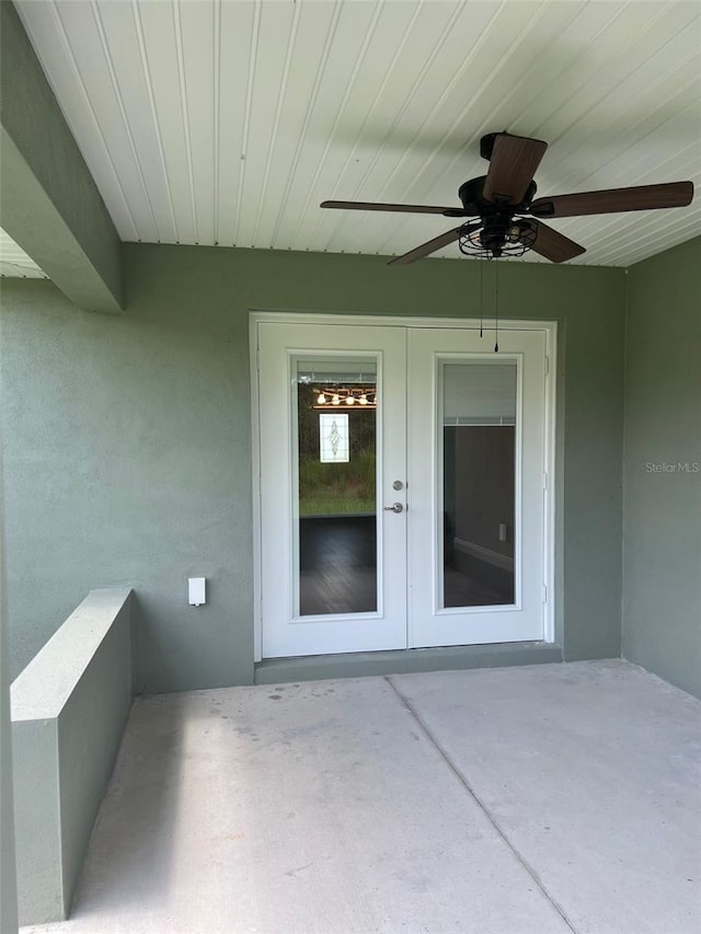 doorway to property with a patio, ceiling fan, and french doors