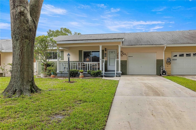 ranch-style house with a garage, a front yard, and covered porch