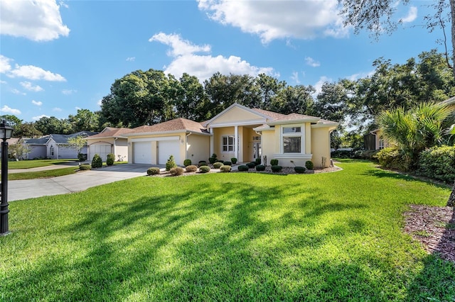 view of front of house featuring a garage and a front yard