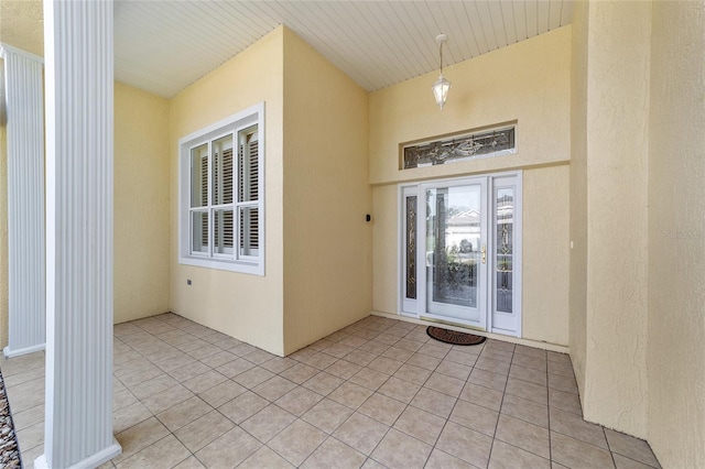 doorway to property with a patio area