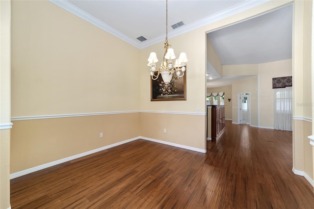 empty room with a notable chandelier, dark hardwood / wood-style floors, and ornamental molding