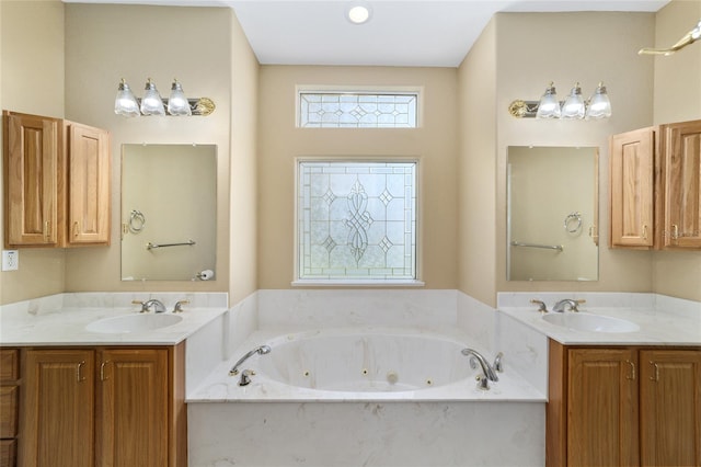 bathroom with vanity and a washtub