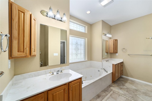 bathroom featuring a tub to relax in and vanity