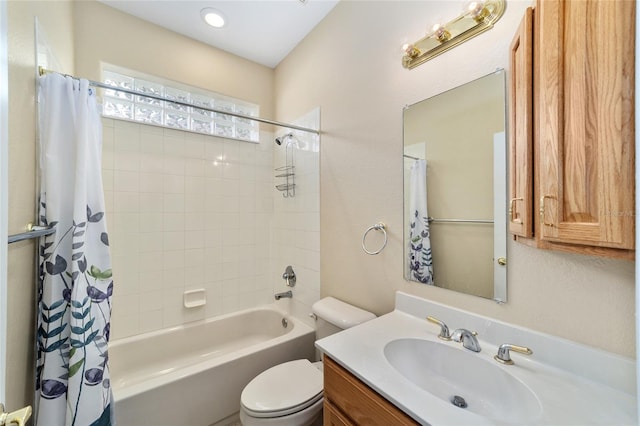 full bathroom with shower / bathtub combination with curtain, vanity, and toilet