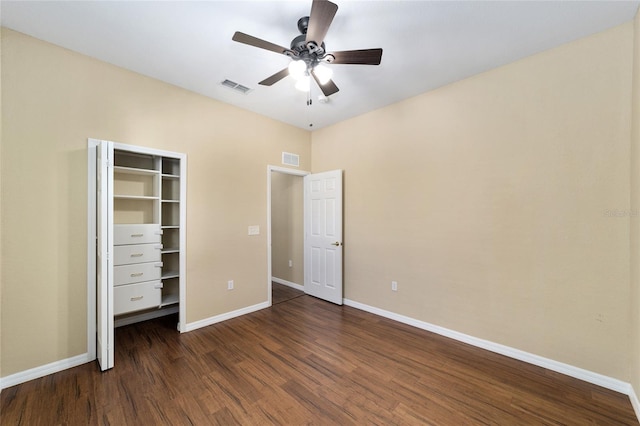 unfurnished bedroom with dark wood-type flooring and ceiling fan