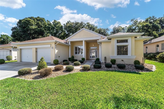 view of front facade featuring a garage and a front yard