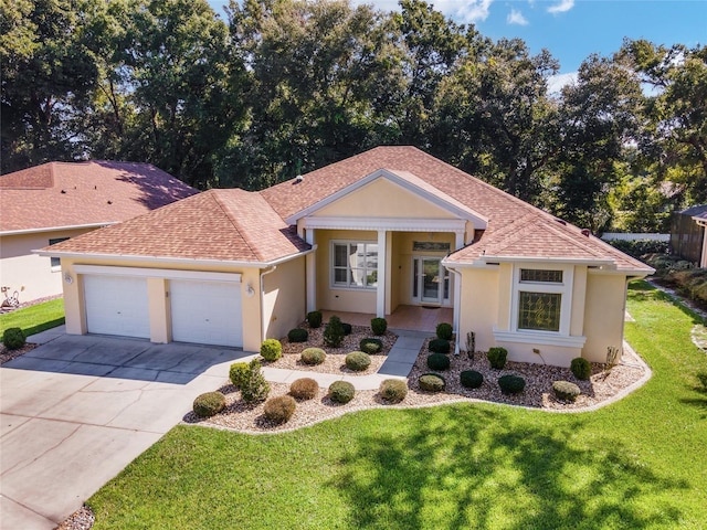 single story home with stucco siding, a front lawn, concrete driveway, and a garage