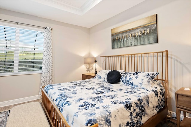 bedroom featuring hardwood / wood-style flooring and crown molding