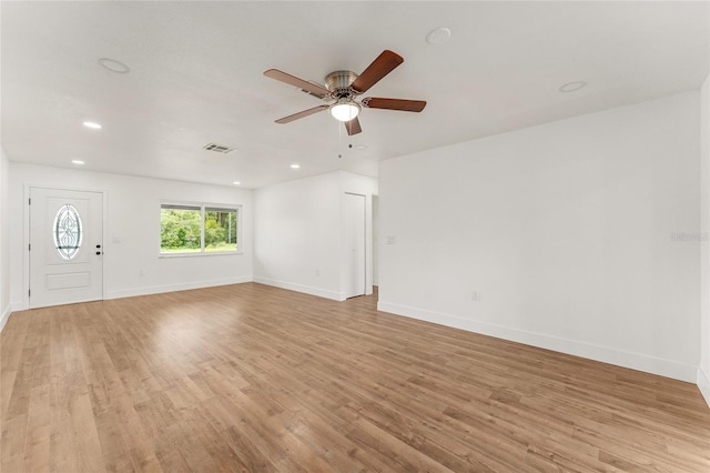 unfurnished living room featuring light hardwood / wood-style flooring and ceiling fan