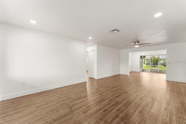 spare room featuring ceiling fan and hardwood / wood-style floors