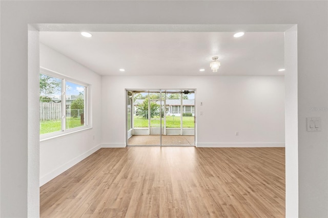 spare room featuring light wood-type flooring