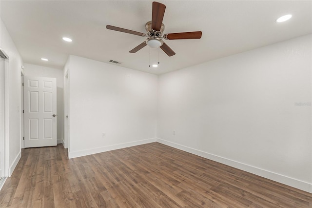 unfurnished room with ceiling fan and wood-type flooring