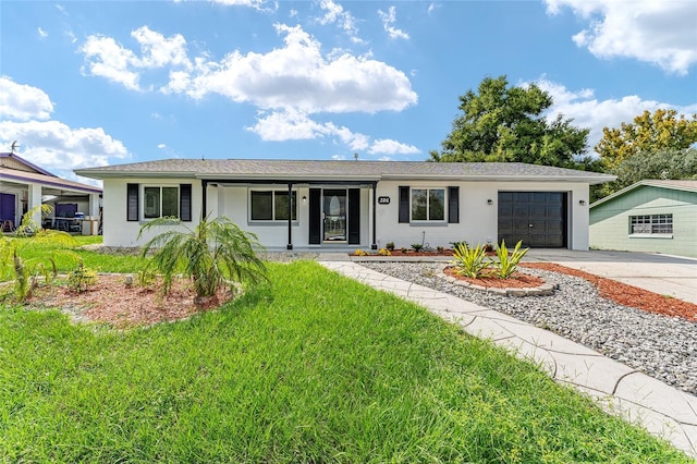 ranch-style house featuring a garage and a front yard