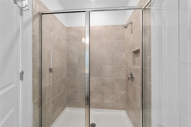 bathroom featuring an enclosed shower