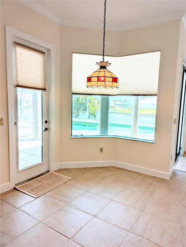 unfurnished dining area with light tile patterned flooring, ornamental molding, and a wealth of natural light