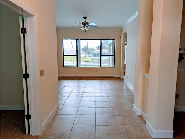 hall with light tile patterned floors and crown molding