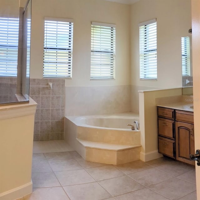 bathroom with tile walls, shower with separate bathtub, tile patterned flooring, and vanity