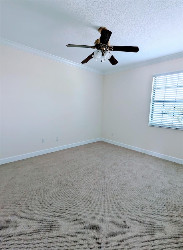 unfurnished room with a textured ceiling, crown molding, ceiling fan, and light carpet