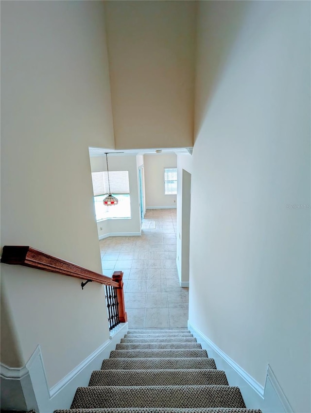 stairway featuring tile patterned floors