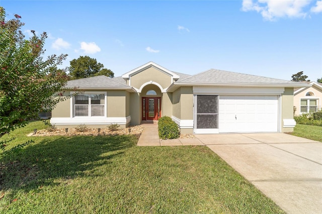 ranch-style house with concrete driveway, stucco siding, roof with shingles, an attached garage, and a front yard