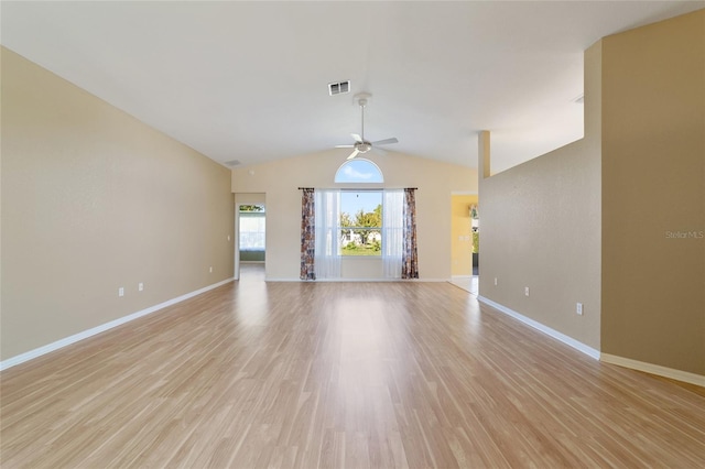 unfurnished room with vaulted ceiling, ceiling fan, and light hardwood / wood-style flooring