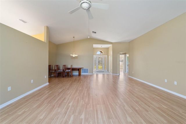 unfurnished living room featuring light hardwood / wood-style flooring, lofted ceiling, and ceiling fan