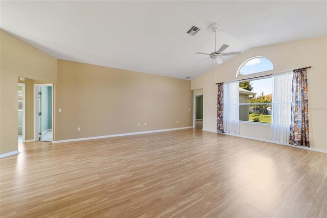 unfurnished living room with light wood-type flooring, vaulted ceiling, and ceiling fan